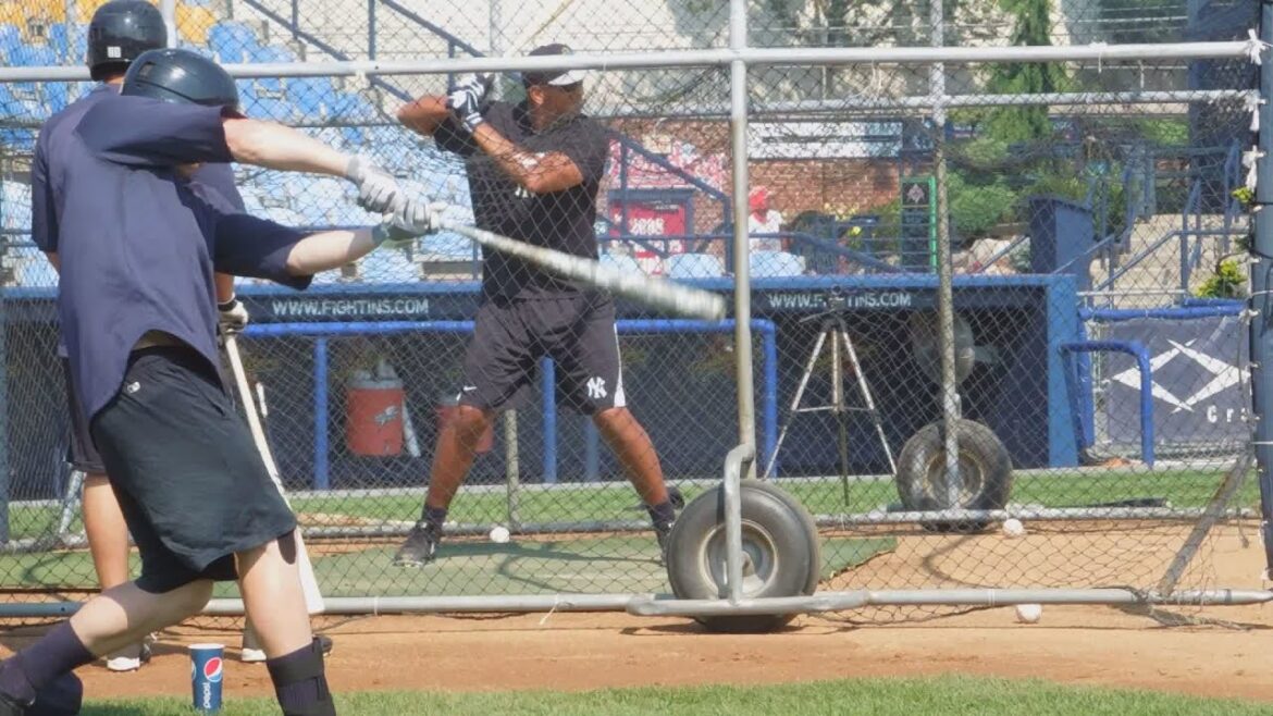Alex Rodriguez takes BP while Ramon Flores and Slade Heathcott watch