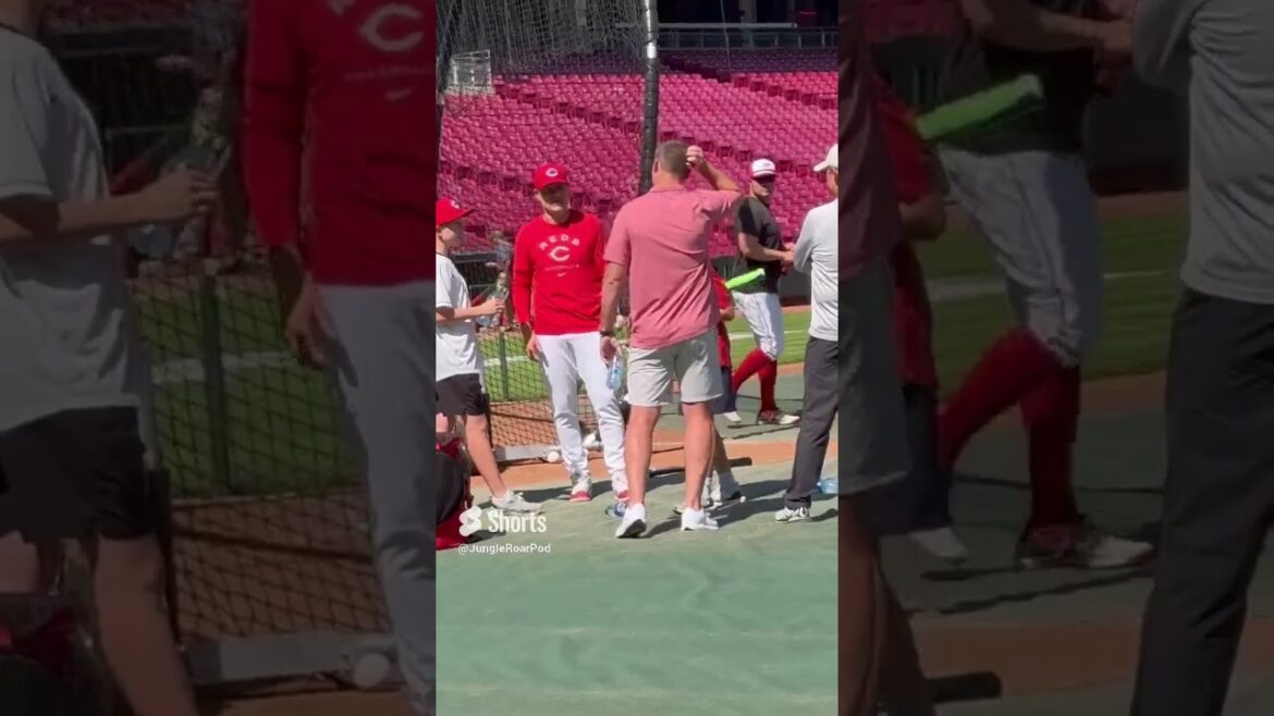 Bengals coach Zac Taylor and Reds manager David Bell catch up before Wednesday’s Reds game